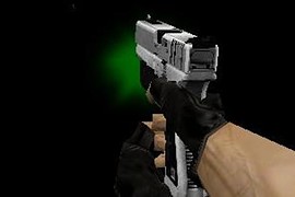 White Glock 18 with green laser